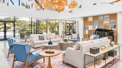 a living room with couches and a piano at Marriott's Sabal Palms 2BR Apartment with Resort Access in Orlando