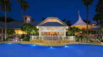 a resort with a swimming pool in front of a building at Marriott's Cypress Harbour 2BR Apartment with Resort Access in Orlando