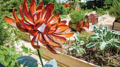 a garden with a large red flower in a garden at Marriott's Cypress Harbour 2BR Apartment with Resort Access in Orlando