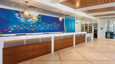 a kitchen with a large painting on the wall at Marriott's Harbour Lake Studio Apartment with Resort Access in Orlando
