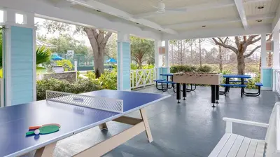 a screened porch with a ping pong table on it at Marriott's Harbour Lake Studio Apartment with Resort Access in Orlando