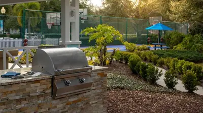 a grill on a brick wall in a garden at Marriott's Harbour Lake 1BR Apartment with Resort Access in Orlando