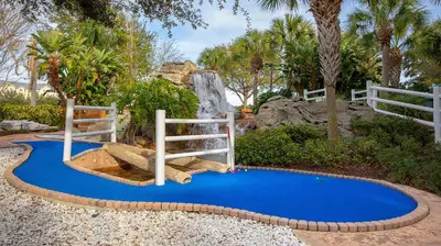 a playground with a slide on a blue ground at Marriott's Harbour Lake 2BR Apartment with Resort Access in Orlando