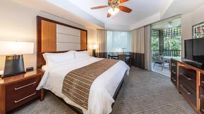 a hotel room with a bed and a flat screen tv at Marriott's Imperial Palms 3BR Apartment with Resort Access in Orlando