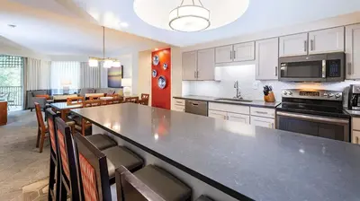 a kitchen with a large table and a dining room at Marriott's Imperial Palms 3BR Apartment with Resort Access in Orlando