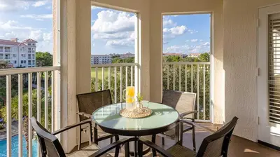 a dining room with a table and chairs and windows at Marriott's Grande Vista Studio Apartment with Resort Access in Orlando