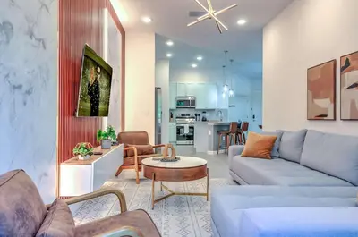 a living room with a couch and a table at 10461 Amazing 5BD Family Townhouse at Paradiso Grande in Orlando