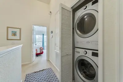 a laundry room with a washer and dryer at Disney Home in Orlando