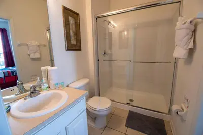 a bathroom with a shower and a sink and a toilet at NEW - Paradise townhome at Windsor Hills in Orlando