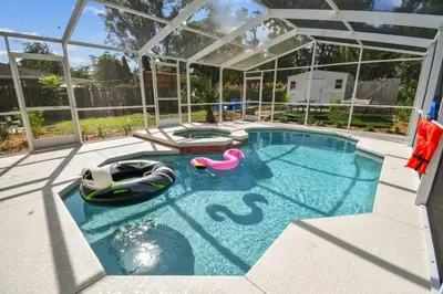 a swimming pool with a pool noodle in a house at Relaxing Modern Home Sleeps 6 Pool BBQ Firepit in Sorrento