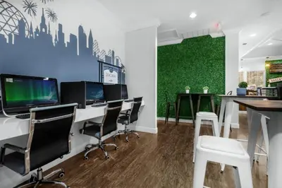 an office with desks and chairs and a green wall at 4 Bedrooms 3 Bathrooms Lucaya 10-108 in Kissimmee