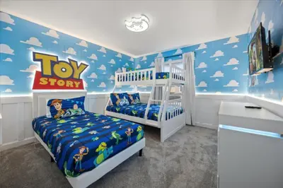 a bedroom with a toy story bedroom with a bed at 4 Bedrooms 3 Bathrooms Storey Lake 2952 Ps in Kissimmee