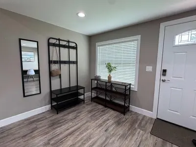 a room with a white door and a mirror at Peace in the Garden - Home in Winter Garden in Orlando