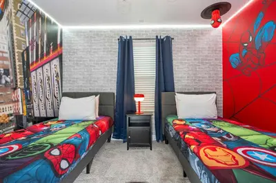 two twin beds in a room with red walls at Private Pool - Themed Rooms - Near Disney 4239 in Kissimmee