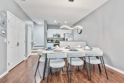 a kitchen and dining room with a table and chairs at Amazing 3 Bdr House near Disney - LV22106 in Kissimmee
