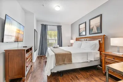 a bedroom with a large bed and a window at Amazing 3 Bdr House near Disney - LV22106 in Kissimmee