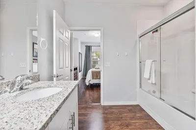 a white bathroom with a sink and a shower at Amazing 3 Bdr House near Disney - LV22106 in Kissimmee