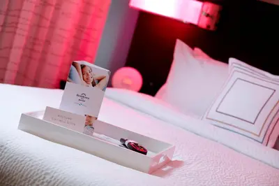 a white bed with two boxes on top of it at Courtyard by Marriott Orlando Lake Nona in Orlando