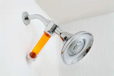 a shower head on a wall with a flashlight at Courtyard by Marriott Orlando Lake Nona in Orlando