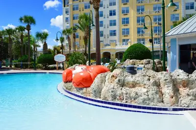 a pool with a large inflatable animal in the water at Calypso Cay Vacation Villas in Kissimmee