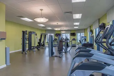 a gym with rows of treadmills and machines at Go08 - STOREY LAKE in Kissimmee