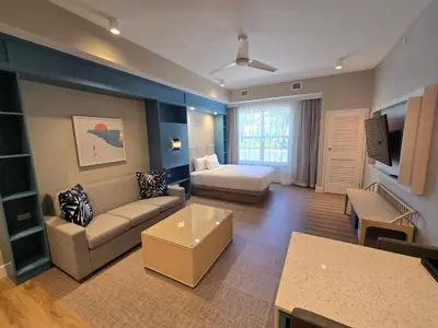 a large living room with a couch and a bed at Go 29 Margaritaville Studio in Orlando