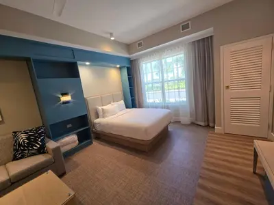 a hotel room with a bed and a couch at Go 29 Margaritaville Studio in Orlando