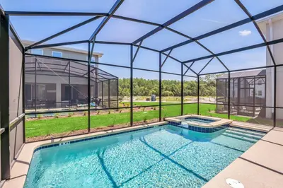 an indoor swimming pool with a glass enclosure at Winterfield storeylake 2759 in Kissimmee