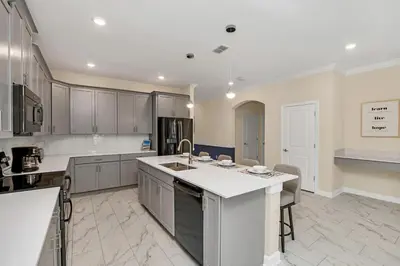 a large kitchen with a sink and a counter at Winterfield storeylake 2759 in Kissimmee