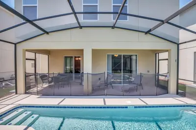 a house with a swimming pool and a patio at Winterfield storeylake 2759 in Kissimmee