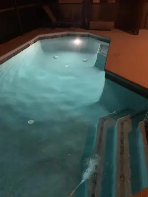 a swimming pool filled with blue water at Resort 4 Br 3 Ba Private Pool Home & Lake View near Disney & Universal in Kissimmee