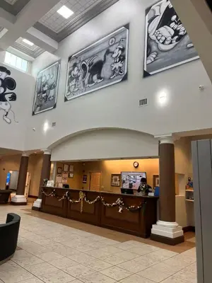 a lobby of a hospital with pictures on the wall at Aqua Condo-Free Shuttle-Disney-Universal EPIC in Orlando