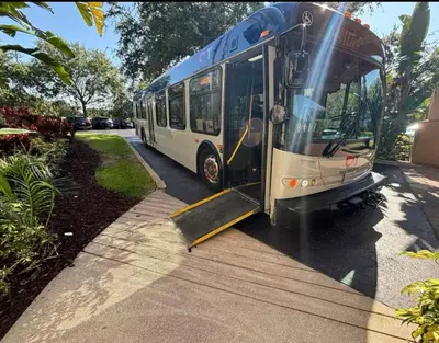 a bus with its door open on a street at Condo-Free Shuttle-Disney-Universal Epic in Orlando