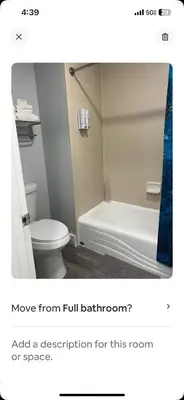 a bathroom with a tub and a toilet and a sink at Condo near Disney-free shuttle to all theme parks in Orlando