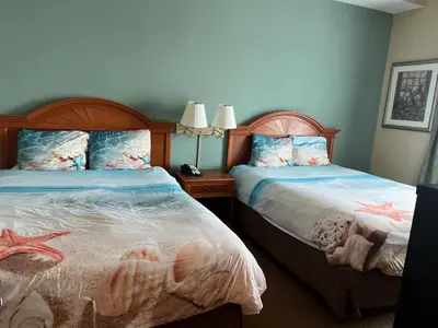 two beds in a bedroom with two mermaid beds at Condo near Disney-free shuttle to all theme parks in Orlando