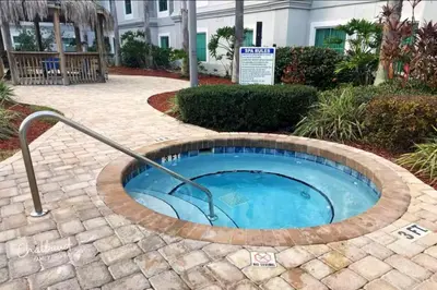 a hot tub in a circle with a metal rail at Condo near Disney Springs-Free shuttle to Parks in Orlando