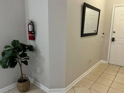 a room with a fire hydrant and a plant on a wall at Apartment Disney Universal Epic in Orlando
