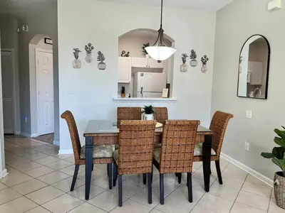 a dining room with a table and chairs at Apartment Disney Universal Epic in Orlando