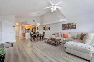 a living room with a couch and a table at 3BR Condo Near Disney, with Clubhouse, Pool and Gym in Kissimmee