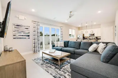 a living room with a couch and a table at 24-7 Vacation Club! Affordable Vacation Stays, Multiple Units Available, All Over Florida! Name your price today! in Kissimmee