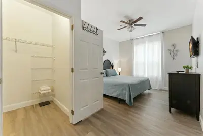 a bedroom with a bed and a ceiling fan at Last Minute Disney Luxury Condo with Balcony. Book Now WP77 in Orlando