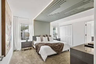 a white bedroom with a large bed and a piano at Storey Lake Resort 510 - Hosted by Top Villas in Kissimmee