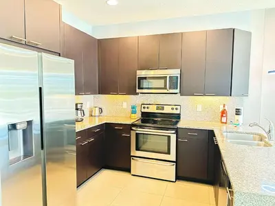 a kitchen with a stove and a microwave at TR1435RC - 3BR - Sleeps 8 in Orlando