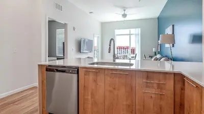 a kitchen with a sink and a counter top at Landing Incredible 1BD Gym Clubhouse in Orlando