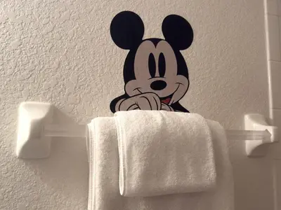 a sticker of a mickey mouse on a towel rack at The Windsor Hideaway in Orlando