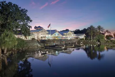 a house with a lake in front of it at Disney's Old Key West Resort in Orlando