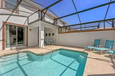 a swimming pool in a house with a glass ceiling at 4BR Pool Home Ideal for Families in Kissimmee