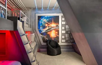 a bedroom with a star wars mural on the wall at Epic Disney Themehouse in Windsor (ADA option) in Orlando