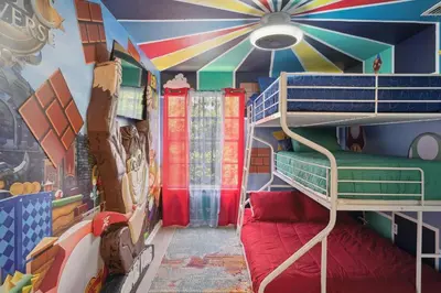 a room with a bunk bed and a mural of a circus at 2022 Royal Bay #94 in Kissimmee