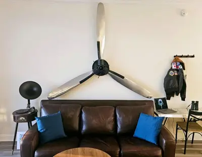 a living room with a couch and two baseball bats on the wall at Stunning waterfront Views 1 mile to Disney 2 bath in Orlando